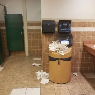 broken paper towel dispenser and overflowing trash.....the 1st thing that greets you when you walk in