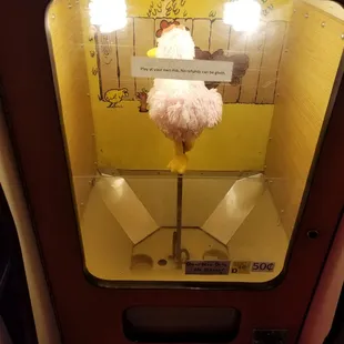 a rotating, clucking chicken w/ no eggs to dispense