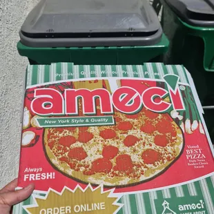 a box of ameci pizza