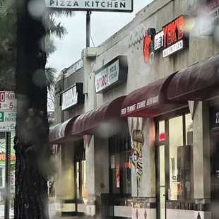 Pizza pasta and sandwiches with other sides and salads and sodas.