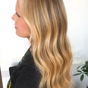 I pop about 10 foils around this natural blondie's face to enhance her brightness. The rest of the blonde is all her!