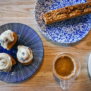 House made biscotti, cinnamon roll bites, and a macchiato.