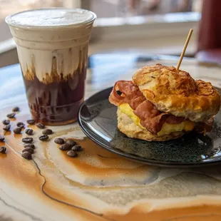 Bacon Egg &amp; Cheese on a Cheddar Biscuit with a Vanilla Sweet Cream Cold Foam Cold Brew