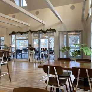 a dining room with tables and chairs