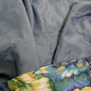 Cigarettes burns, stains on bedding