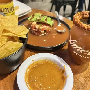 Complimentary chips and salsa, shrimp ceviche, mango margarita