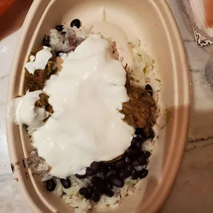 Disgusting Mexican plate smothered in sour cream. This was supposed to be chili Verde Mexican plate.