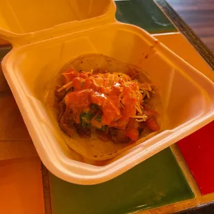 Taco Al Pastor with pico, cheese, and salsa roja