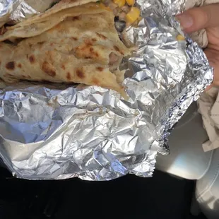 a person holding a piece of food