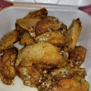 2 orders of Garlic parmesan wings . They were perfect. Crispy and flavorful with tender meat. $12 for 16. Carryout special.