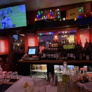 a bar with a television in the background