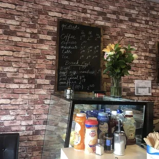 a brick wall with a menu on it