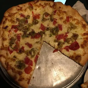 White pizza with hungarian peppers with roasted red peppers.