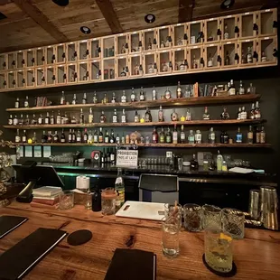 a bar with shelves of liquor