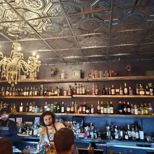 a bar with a chandelier