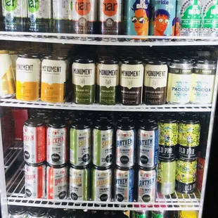 a fridge full of cans of beer