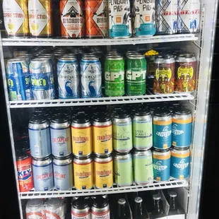 a refrigerator full of cans of beer