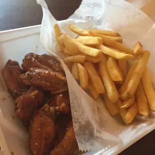 Teriyaki-lemon pepper wings and fries with they&apos;re seasoning! Muy delicioso!