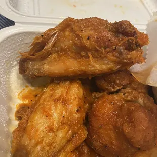 Bone in wings with feathers still attached (top left)