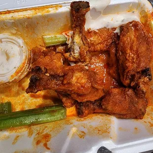 chicken wings in a styrofoam container