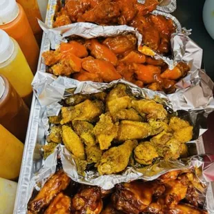a tray of chicken wings and carrots