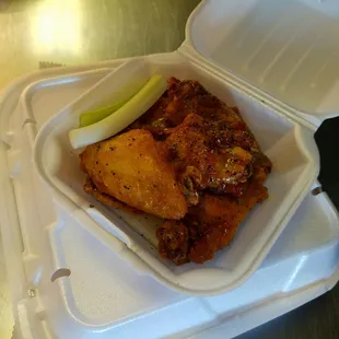 a chicken sandwich in a styrofoam container