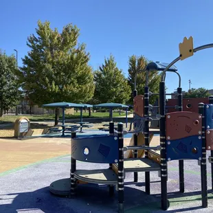 Play structure and picnic tables