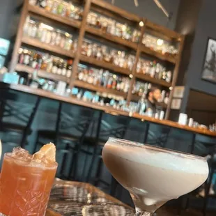 two cocktails on a bar