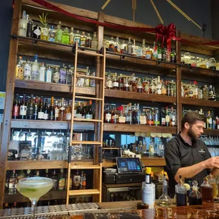 a bartender at the bar