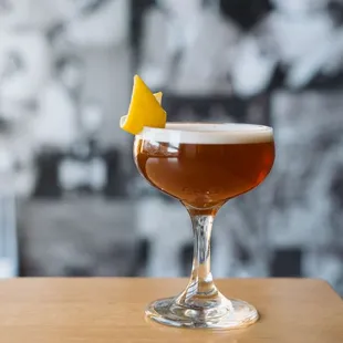 a drink in a glass on a table