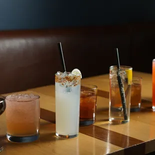 a row of cocktails on a table