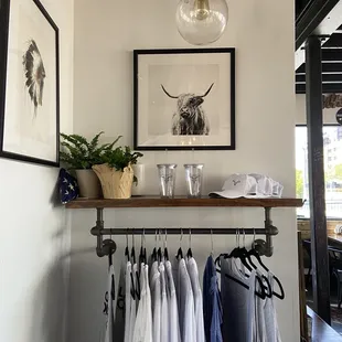 clothes hanging on a rack in a room