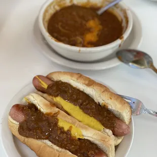 two chili dogs with mustard