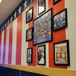 a row of framed pictures on the wall