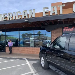 The front of the store to me it looks like the American eat sign