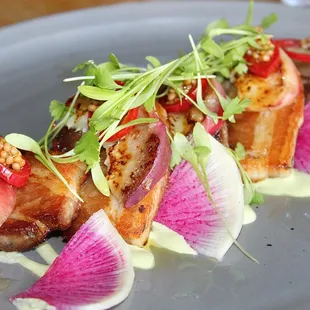 The Crispy Pork Belly was made with jalapeno crema, grilled peaches, pickled fresno chile, mustard seed, &amp; radish.