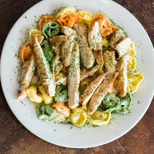 a plate of chicken and pasta