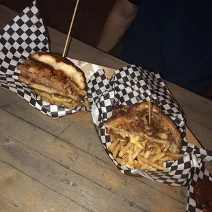 two sandwiches and french fries