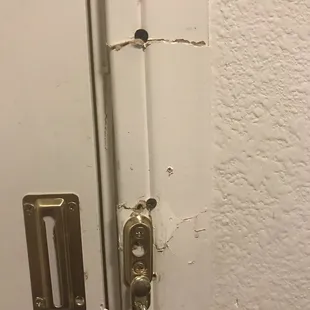 Evidence of door being kicked in previously.