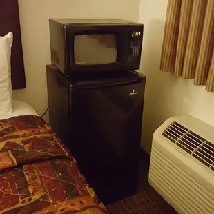 Fridge and microwave in some rooms