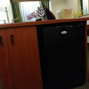 Under the counter fridge and cabinets.