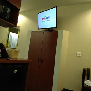 Pretty good sized TV up there. You can watch from couch or bed, either way.