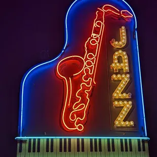 a neon sign of a saxophone