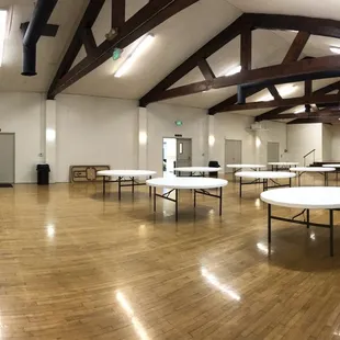 Main area from front lobby's view with the kitchen and miscellaneous room on other end.