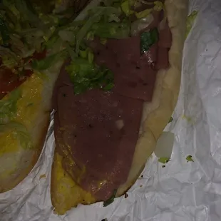 a sub sandwich with lettuce and meat