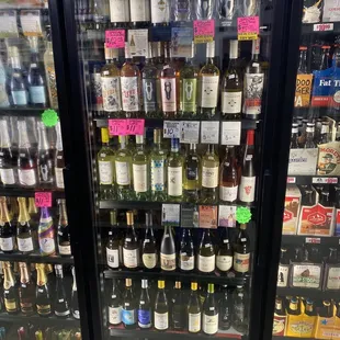 bottles of wine on display in refrigerator