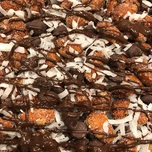 Almond Joy lovers, this is for you! Honey roasted almonds, chocolate chips and coconut, drizzled with dark chocolate.