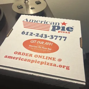 a pizza box on a table