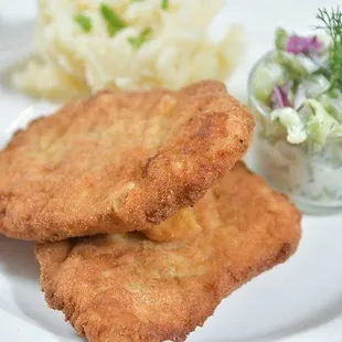 Crispy pork chops with a cool cucumber salad and mashed potatoes