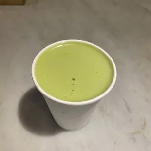 a cup of matcha on a table